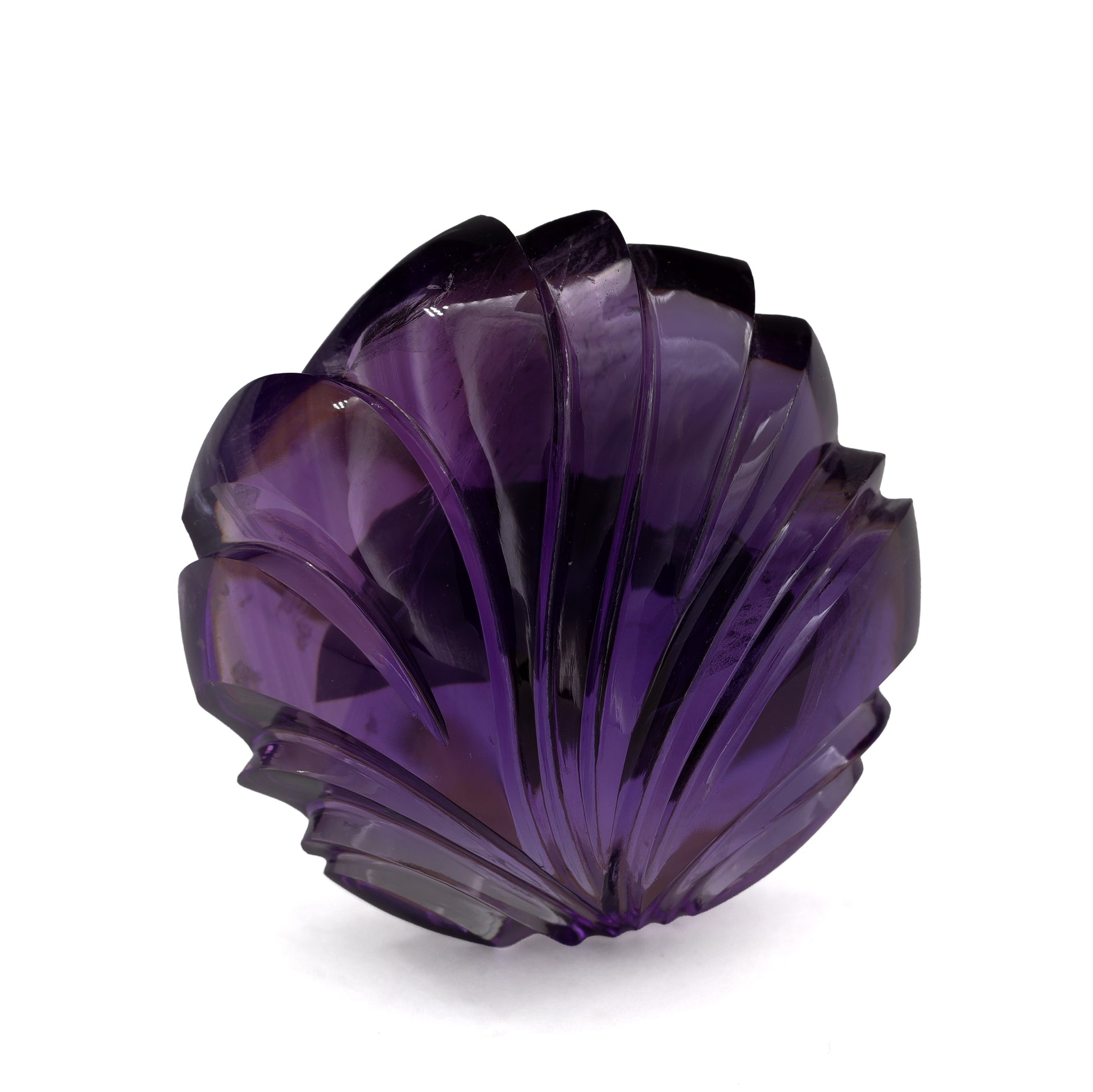 Nick Alexander carved amethyst round on white background
